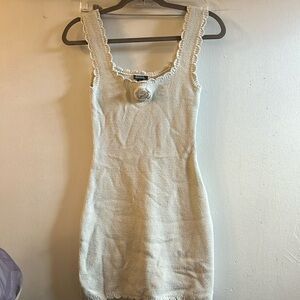 Cute knitted dress with flower in front